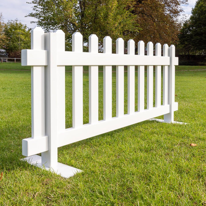 Single portable picket fence panel in white vinyl with steel mounts, 6ft x 2ft 8in temporary fencing by Simple Fencing.