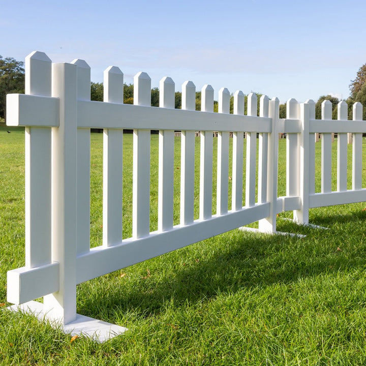 White portable picket fence panel with strong steel base mounts, 6ft x 2ft 8in vinyl fencing solution by Simple Fencing.