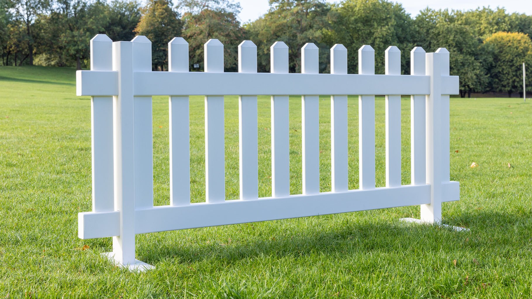 Freestanding portable white PVC picket fence panels with steel mount feet