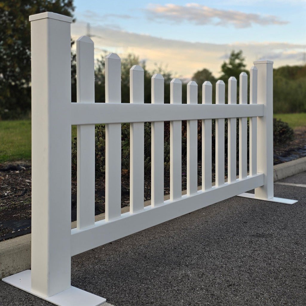 A side view of the Simple Fencing portable classic scalloped picket fence panel, highlighting the durable, low-profile steel foot and support system.